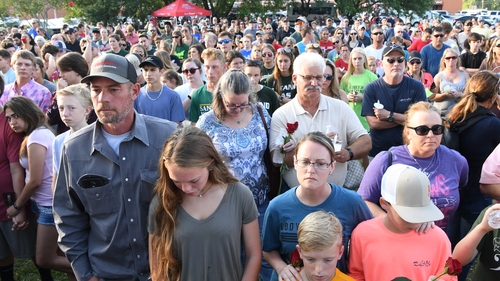 Thousands mourned the victims at a service last night