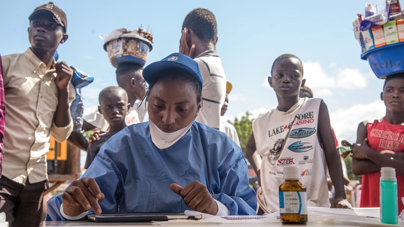 Nurses working with the World Health Organisation prepare to administer vaccines in Mbandaka