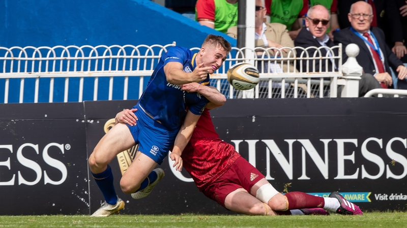 Larmour offloads against Munter in the semi-final