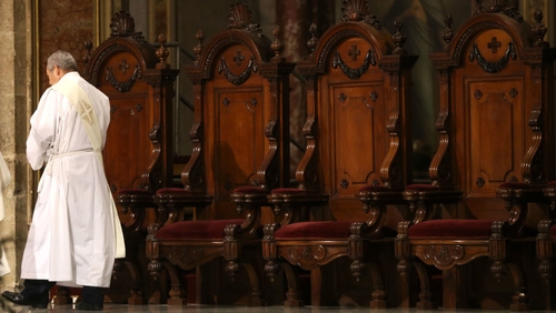 The 14 priests are suspended while they are being investigated for 'improper conduct'