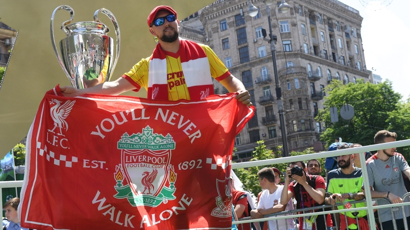 A Liverpool fan gets in the mood in Kiev