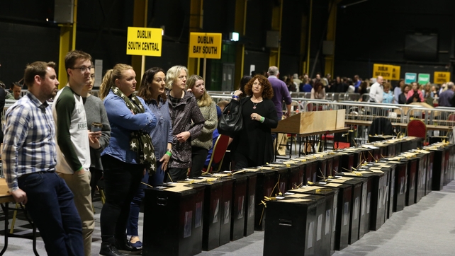 Workers wait to start counting in the RDS in Dublin this morning