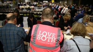 A LoveBoth supporter watches as votes are counted at Dublin's RDS