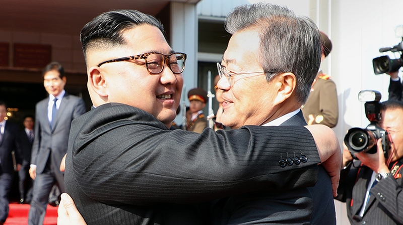 South Korean President Moon Jae-In (R) and North Korean leader Kim Jong-un hugging each other after their second summit in the North Korean side of the demilitarised zone