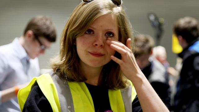 A pro-choice supporter weeps as the referendum result becomes clear