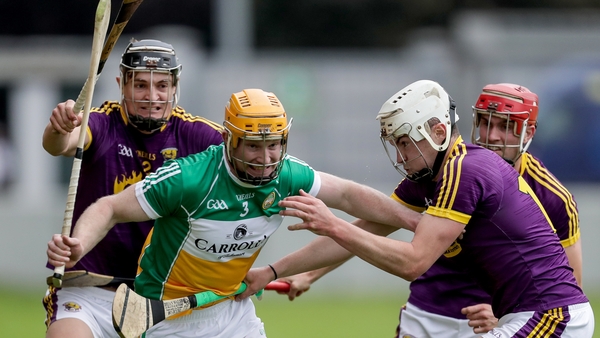 Sean Gardiner of Offaly surrounded - the full-back has since been sent-off