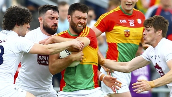 Carlow's Shane Redmond holds off Kildare's Chris Healy