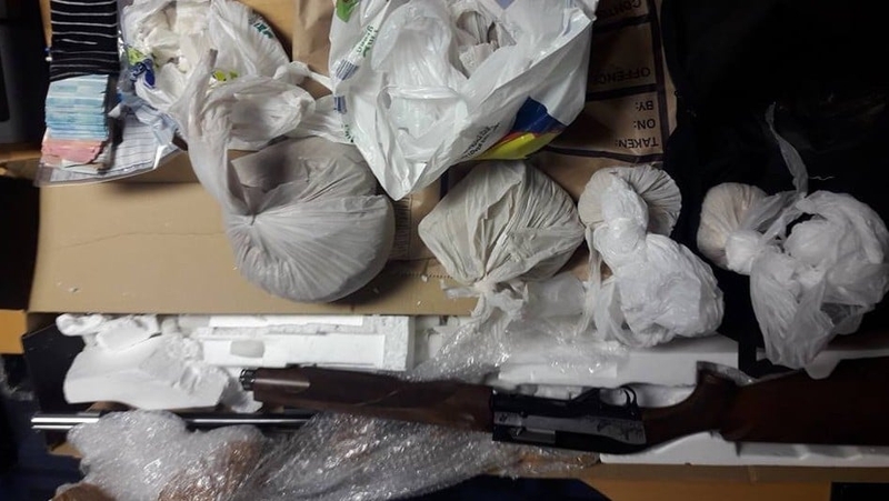 Two people have been arrested in connection with the gun and drugs seizure