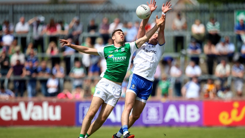 Conall Jones and Dessie Ward battle for the ball