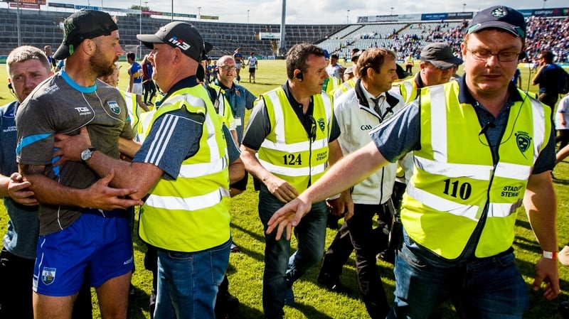 Waterford selector Dan Shanahan confronts the umpires after the game