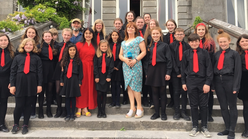 The Westport Children's Choir, pictured here with RTÉ reporter Teresa Mannion, were spotted on YouTube by World-famous composer Cristian Grases