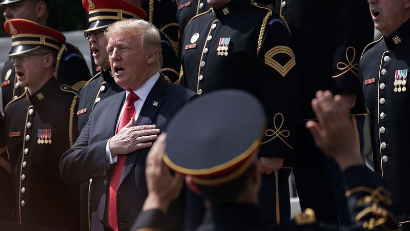 President Trump sings the national anthem with a US Army chorus during the Celebration of America event