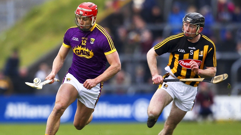 Lee Chin and Conor Delaney in action during the Allianz League semi-final, a game the Cats won comfortably by 12 points