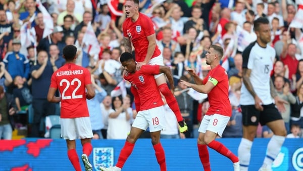 Marcus Rashford celebrates with Phil Jones, Jordan Henderson and Trent Alexander-Arnold after scoring England's opener