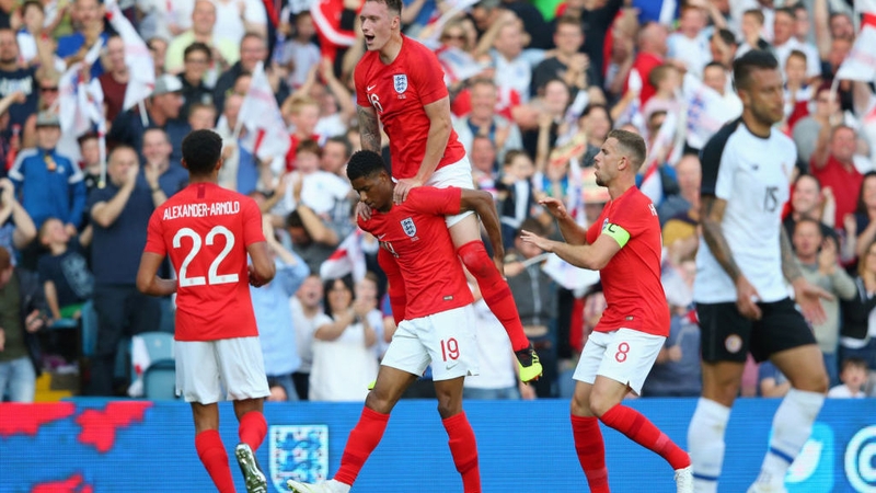 Marcus Rashford celebrates with Phil Jones, Jordan Henderson and Trent Alexander-Arnold after scoring England's opener