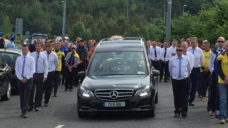The funeral cortege arriving at St Mochonog's Church in Kilmacanogue