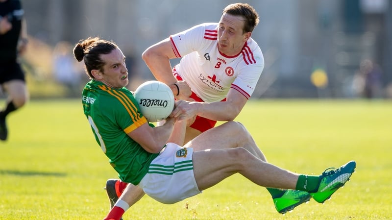 Meath's Cillian O'Sullivan and Colm Cavanagh of Tyrone
