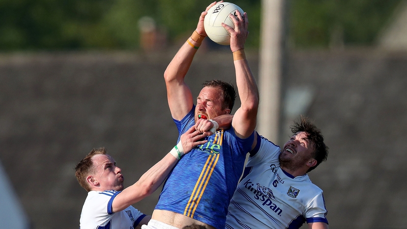 Wicklow's James Stafford jumps with Martin Reilly and Conor Moynagh of Cavan