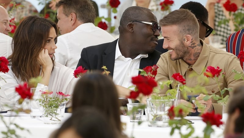 David and Victoria Beckahm beamed at each other at a London Fashion Week event on Sunday