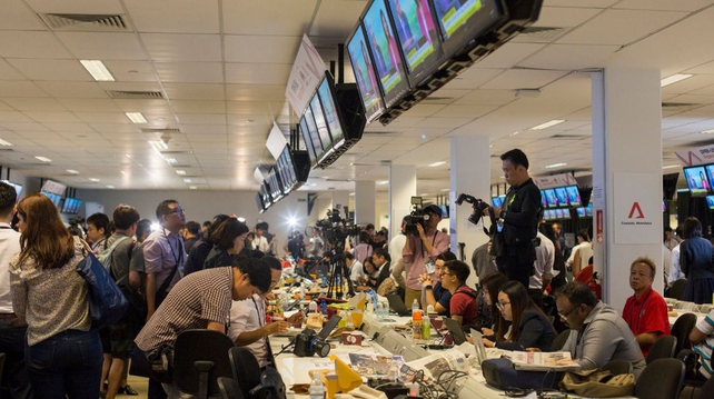 Journalists report from the International Media Centre as the unprecedented meeting between the two leaders takes place