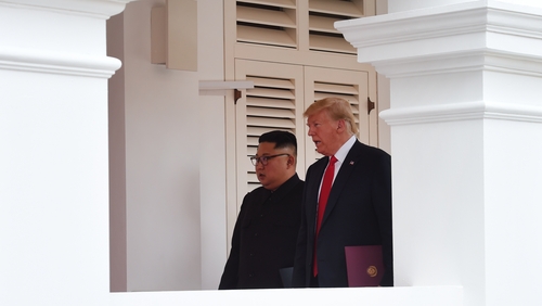 Two 'alpha males' meet face-to-face in Singapore