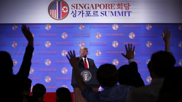 Donald Trump answers questions from the media after the summit