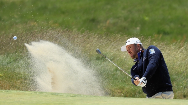 McDowell plays a bunker shot during US Open practice