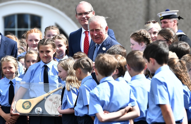 Prince Charles meets school children during a visit to Cork Naval Base