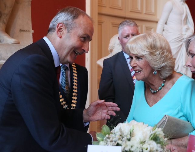 The Duchess of Cornwall speaks to Micheál Martin during the dinner at Crawford Art Gallery