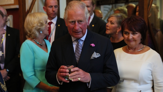 Prince Charles and the Duchess (L) attend a dinner at Crawford Art Gallery as part of their tour