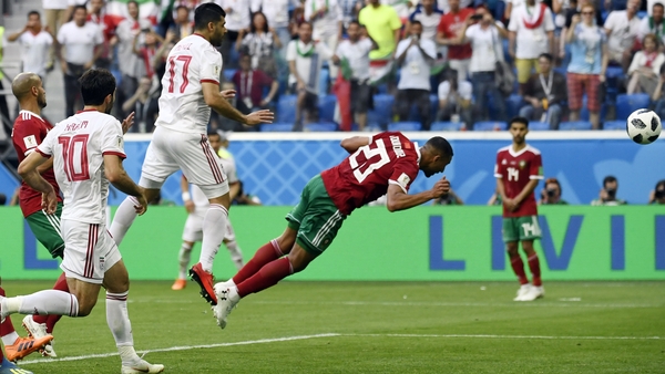Morocco's Aziz Bouhaddouz scores the winner for Iran