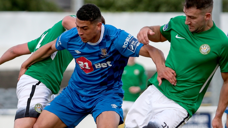 Waterford's Courtney Duffus with Sean Harding and Rhys Gorman of Bray
