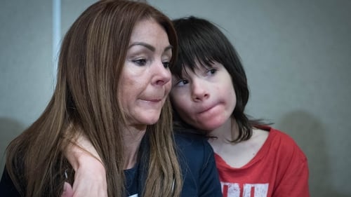 Billy Caldwell pictured with his mother Charlotte at Heathrow Airport
