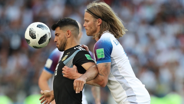 Birkir Bjarnason battles with Sergio Aguero