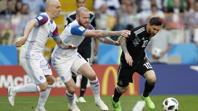 Emil Hallfredsson and Aron Einar Gunnarsson track down Lionel Messi