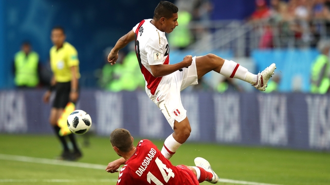 Henrik Dalsgaard and Edison Flores battle for the ball in Saransk