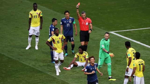 Carlos Sanchez of Colombia is shown a red card for a deliberate hand-ball