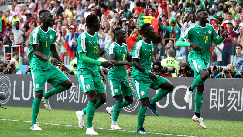 M'baye Niang celebrates with his team-mates following Senegal's second goal of the game