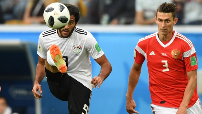 Egypt's forward Marwan Mohsen kicks the ball next to Russia's defender Ilja Kutepov
