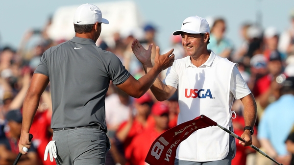Ricky Elliott (r) celebrates with Brooks Koepka