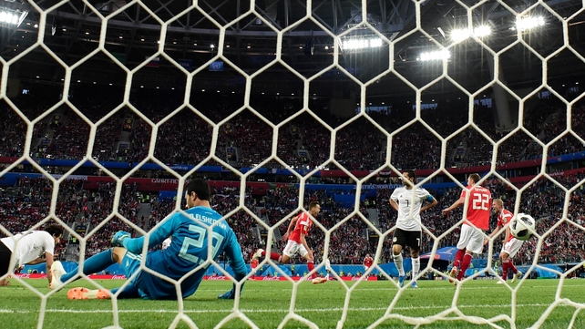 Russia's midfielder Denis Cheryshev scores his side's second