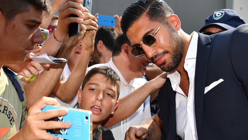 Emre Can greeted by fans at the airport