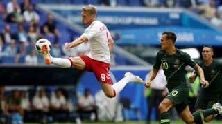 Nicolai Jorgensen of Denmark controls the ball under pressure of Trent Sainsbury