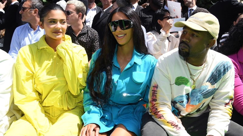 Kim Kardashian West at the Louis Vuitton show with husband Kanye West and half-sister Kylie Jenner