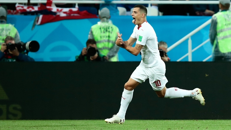 Granit Xhaka celebrates his goal against Serbia by making a gesture with his hands that was an apparent nod to the Albanian flag.