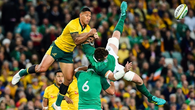 Israel Folau and Peter O'Mahony contest a restart