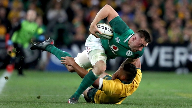 Jack Conan barrels through the Australian tackler