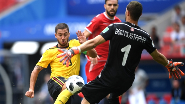 Eden Hazard rounds the Tunisian keeper Ben Mustapha to score his second and Belgium's fourth
