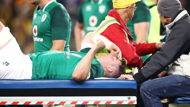 Ireland captain Peter O'Mahony leaves the field on a medicab