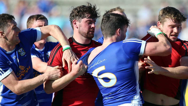 Down and Cavan players tussle after the game